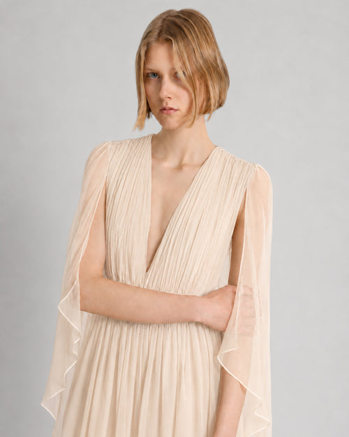 Long chiffon dress with V-neckline and cape