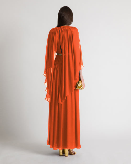 Long silk gown with shoulder-revealing cape