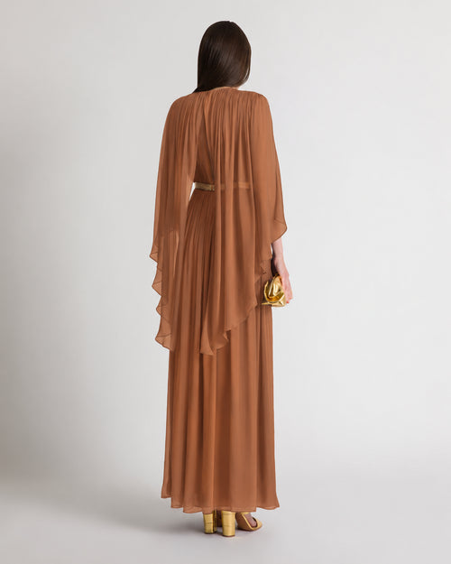 Long silk gown with shoulder-revealing cape
