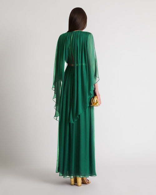 Long silk gown with shoulder-revealing cape