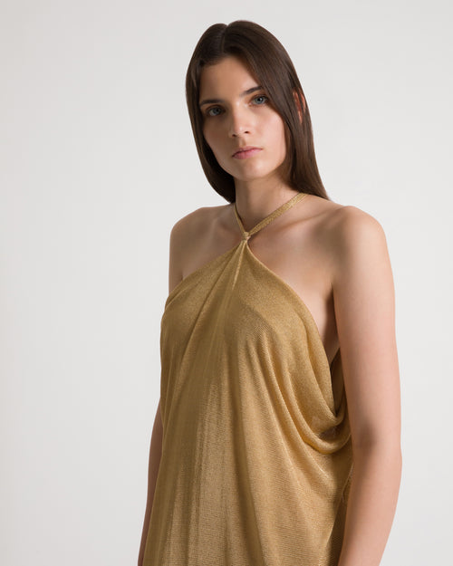Abito lungo in lurex oro con schiena scoperta