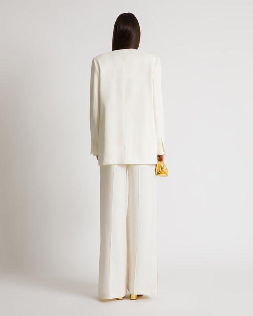 Chaqueta cruzada con botones dorados