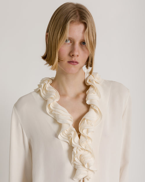 Fluid blouse with sculptural ruffled collar