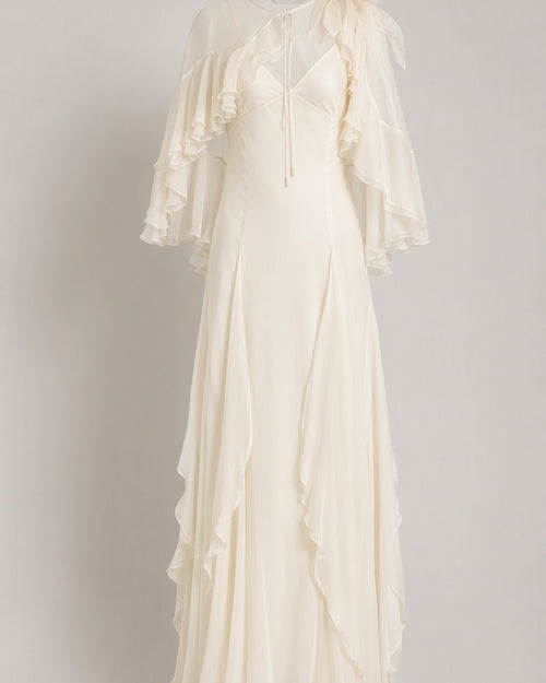 Abito in chiffon di seta con cappa 