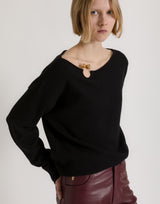 Wool, silk, and cashmere sweater with floral brooch