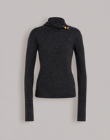 Wool, silk, and cashmere turtleneck sweater with brooch